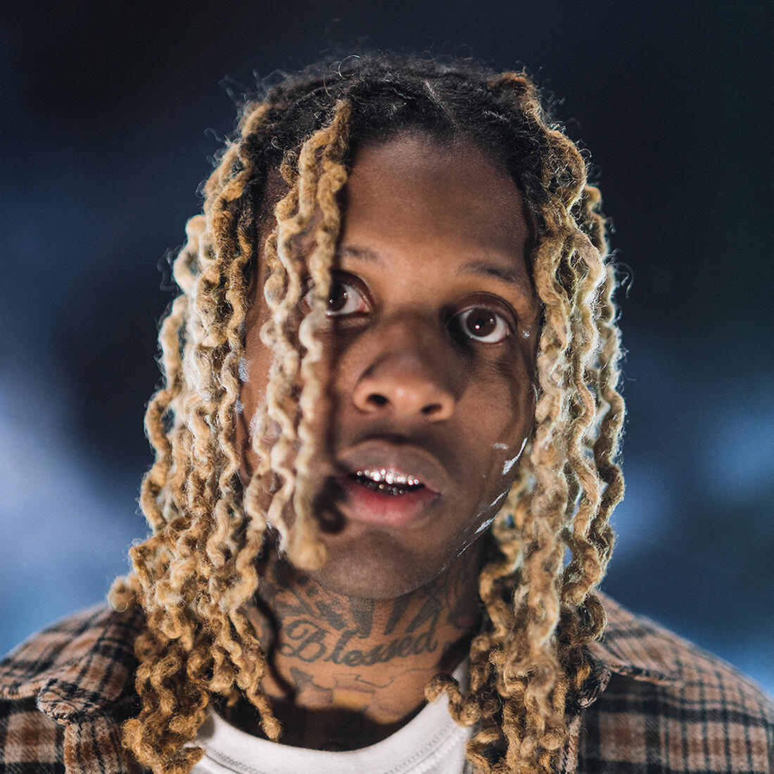 Lil Durk at a music event, facing legal challenges